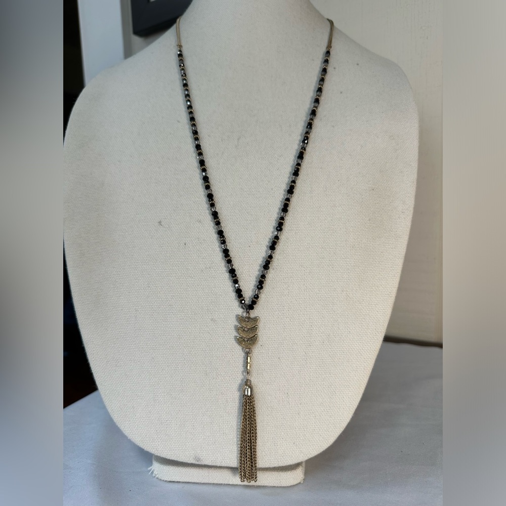 Long black and clear faceted bead tassel necklace